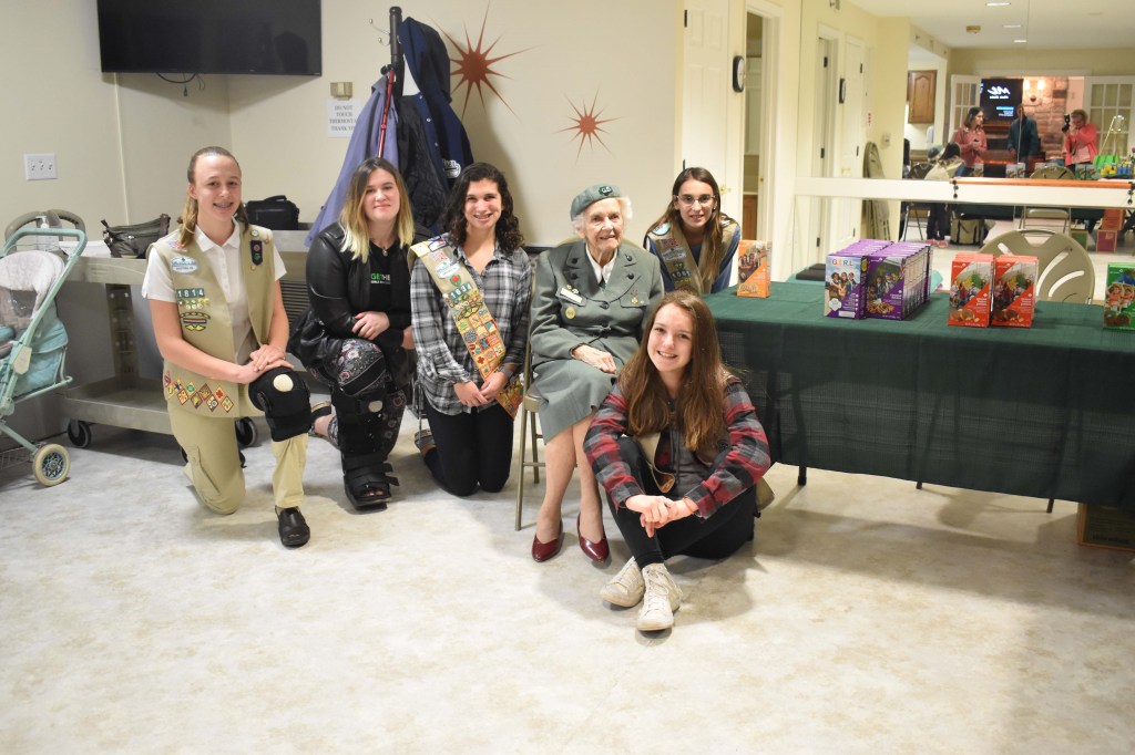 Ronnie Backenstoe in a photo with other members of the Girl Scouts. Backenstoe has sold cookies since she was 10.